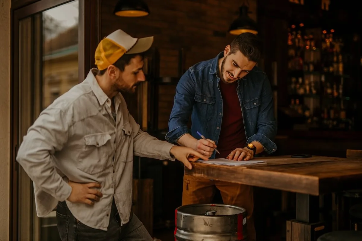 Restaurant inventory management: worker writing on a piece of paper