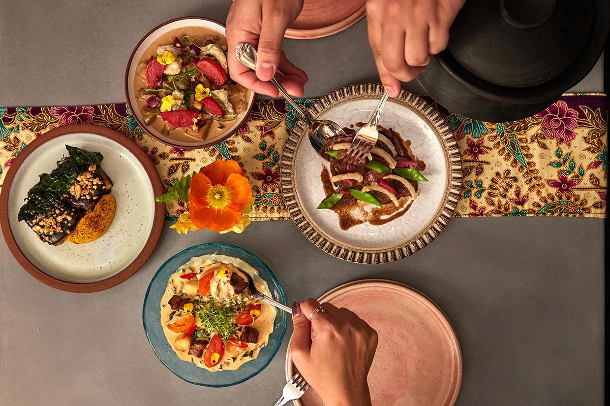 Photo of four different dishes from Kaya's five-course “sama-sama” tasting menu from Blake Jones.