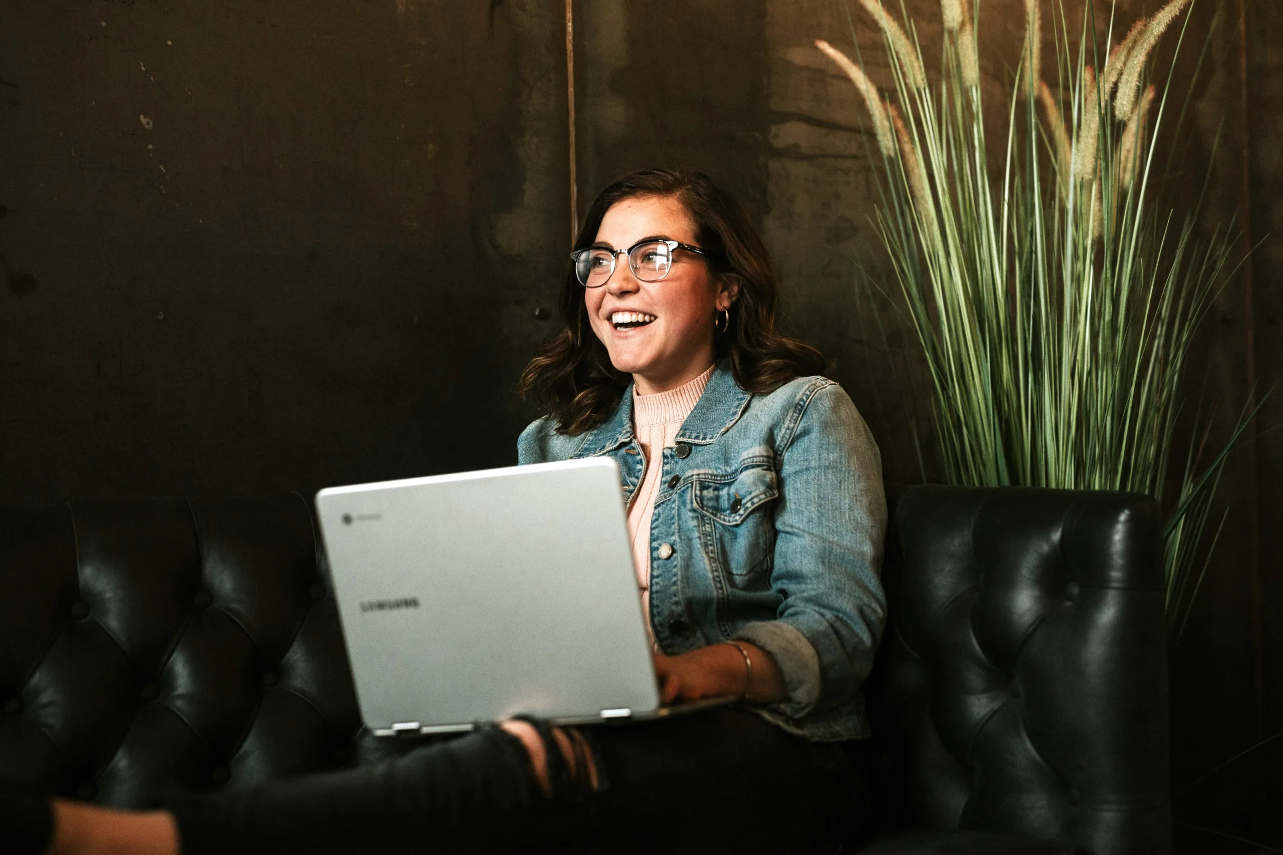 Business owner responding to reviews on laptop