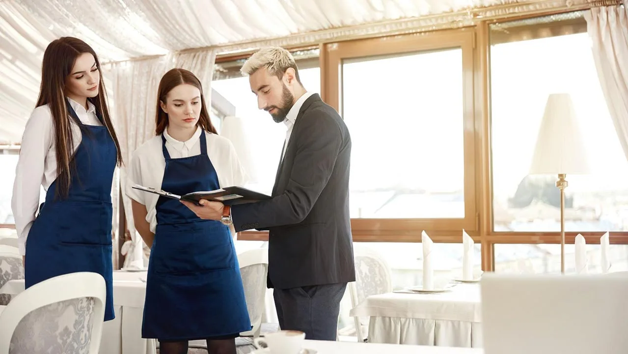 A restaurant team preparing for an upcoming event together.