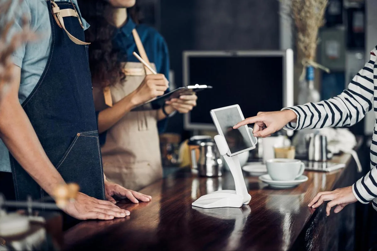 A restaurant manager is using an AI system to assist with operations.