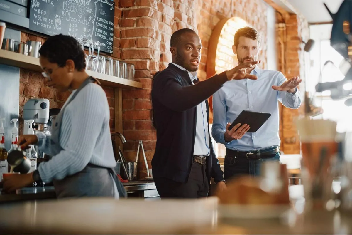 Restaurant managers are having a discussion about tiered pricing options.