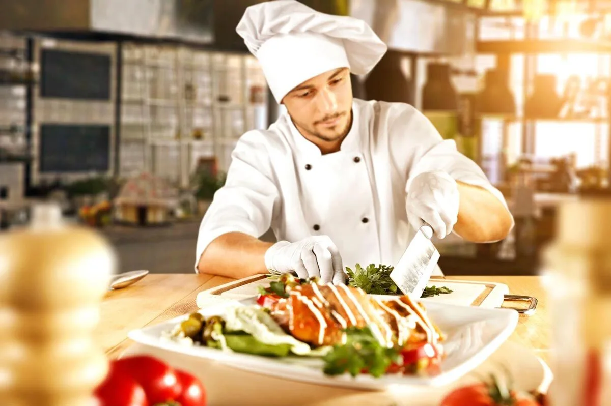 Chef carving a holiday season platter for a festive meal.