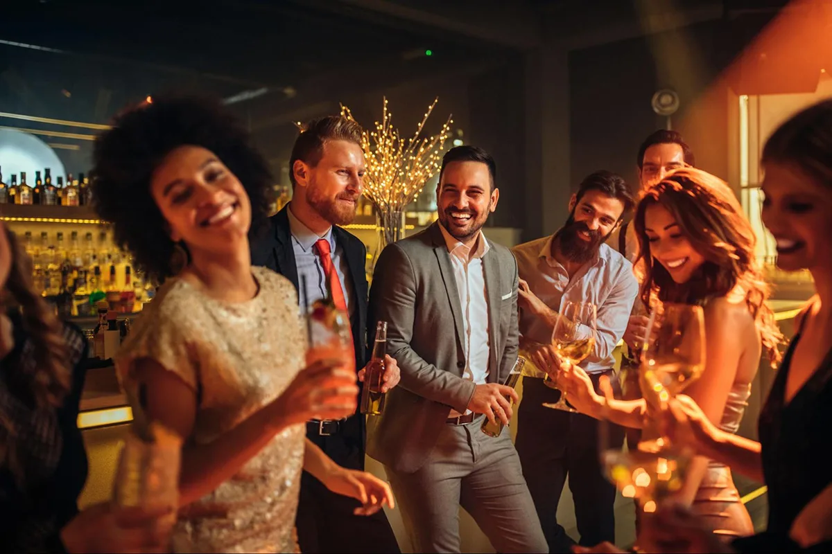 Friends enjoying themselves at a festive holiday-themed party.