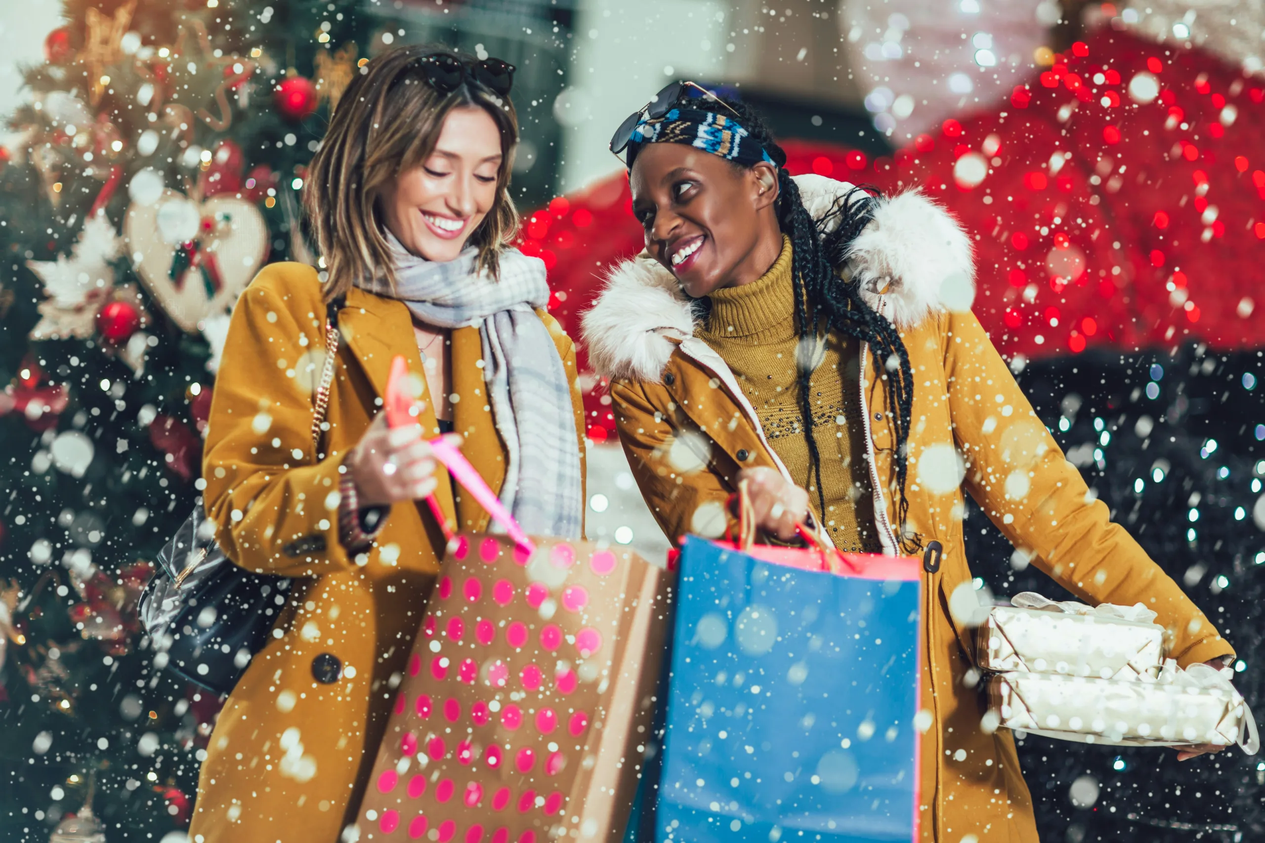 Holiday shoppers carrying shopping bags and enjoying the winter season