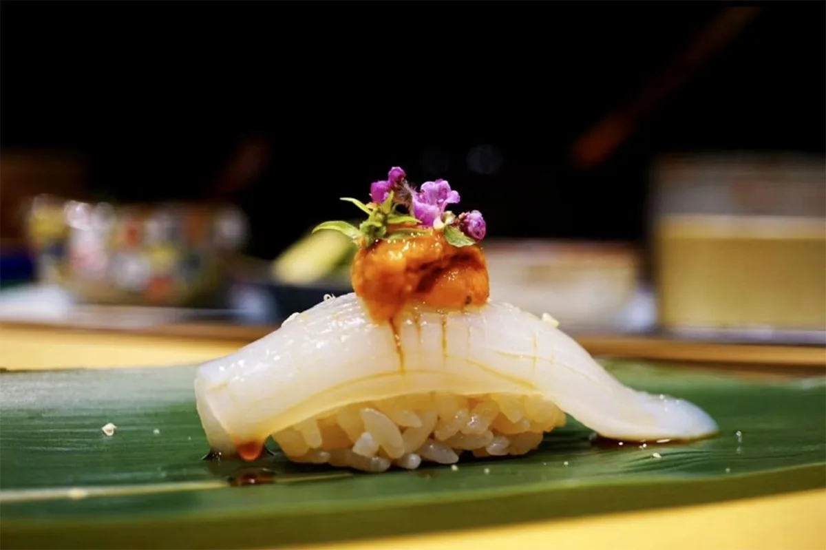 Photo of Tatsumi Sushi's Sumi Ika Nigiri, a traditional type of sushi made with golden cuttlefish.