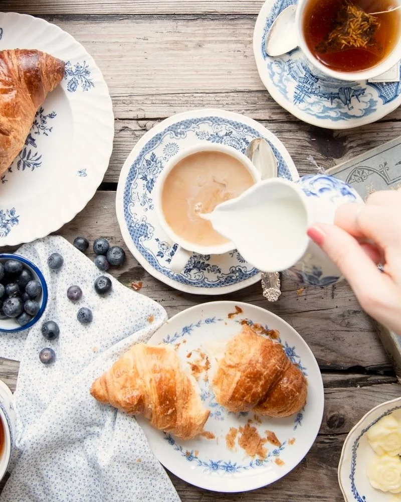 Photo of Maman's iconic blue and white, mismatched plates and cups from Maman on Yelp.